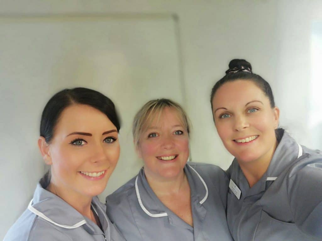 3 smiling Premier Homecare carers